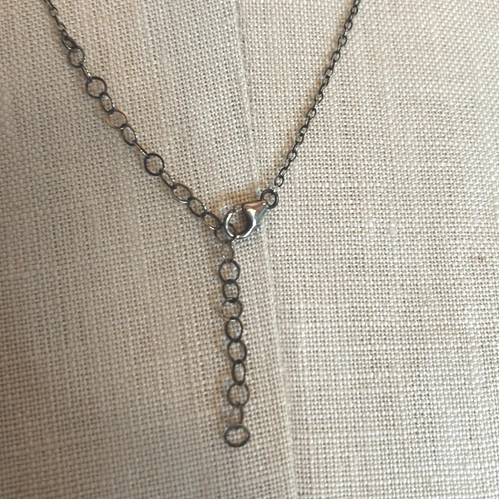 Silvertone heart charm dainty necklace with delicate white pearls on the chain